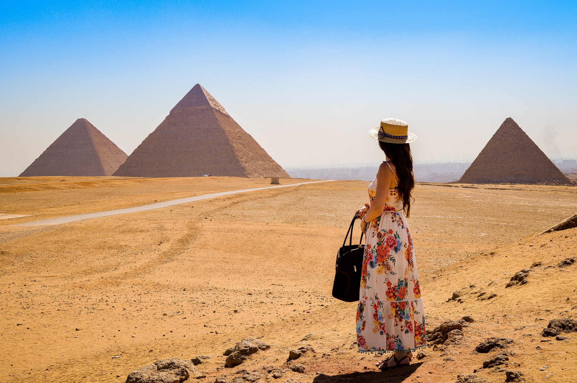 young-woman-visiting-pyramids-egypt.jpg